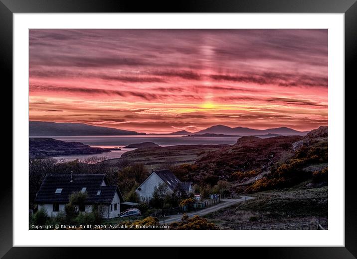 A light pillar rising beyond the Outer Hebrides. Framed Mounted Print by Richard Smith