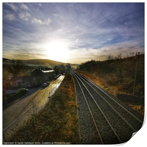 Rail and road at sunrise, Mossley Print by Sarah Paddison