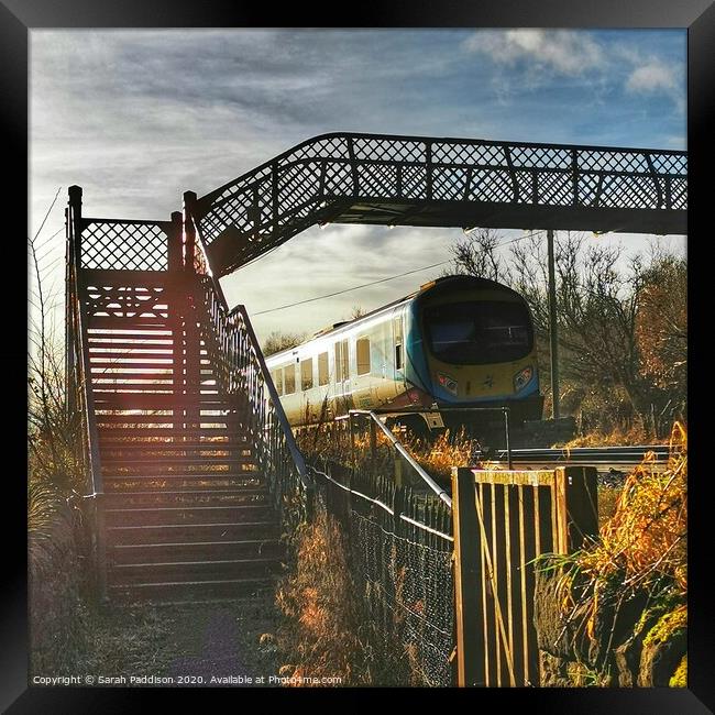 Iron railway bridge with train, Mossley Framed Print by Sarah Paddison