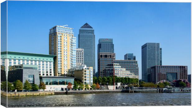 Canary Wharf business district viewed form the Thames on The Isle of Dogs, London, UK. Canvas Print by Peter Bolton