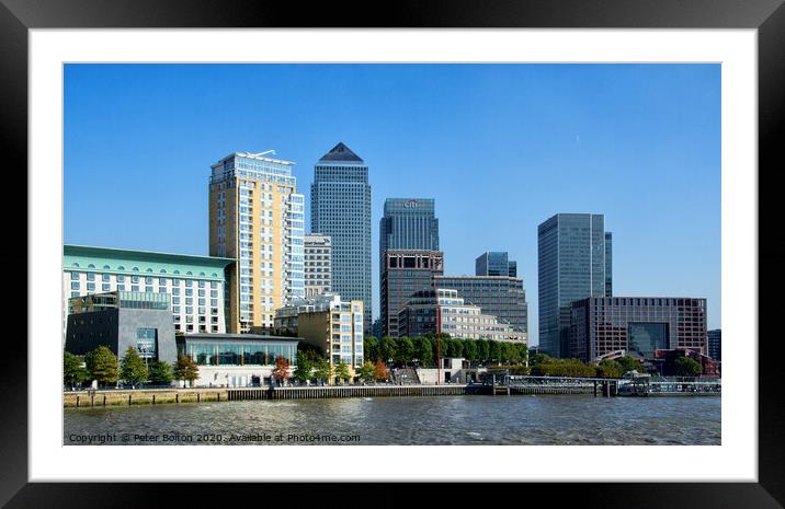Canary Wharf business district viewed form the Thames on The Isle of Dogs, London, UK. Framed Mounted Print by Peter Bolton