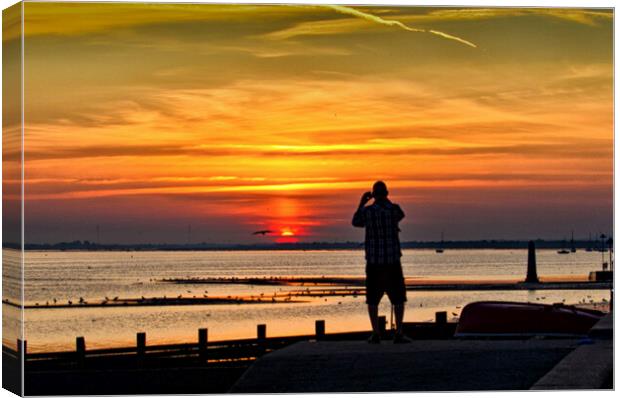 Watching the sunset at Chalkwell, Southend on Sea, Essex, UK. Canvas Print by Peter Bolton