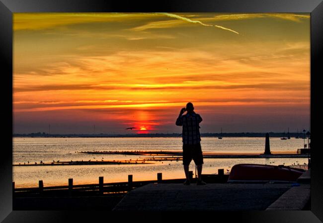 Watching the sunset at Chalkwell, Southend on Sea, Essex, UK. Framed Print by Peter Bolton