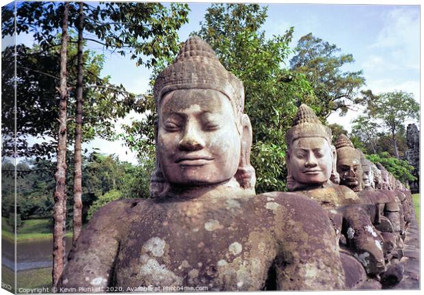 Statues of Angkor Wat, Cambodia  Canvas Print by Kevin Plunkett