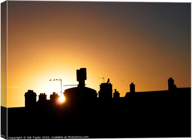 Rooftop sunset Canvas Print by Nik Taylor