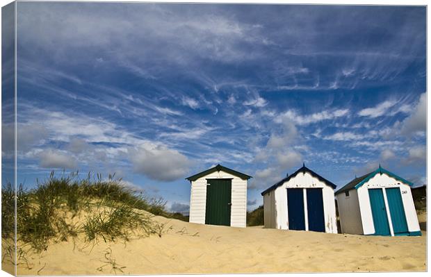 Clouds over Southwold Beach Huts Canvas Print by Paul Macro