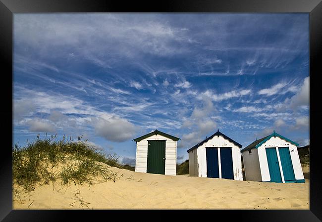 Clouds over Southwold Beach Huts Framed Print by Paul Macro