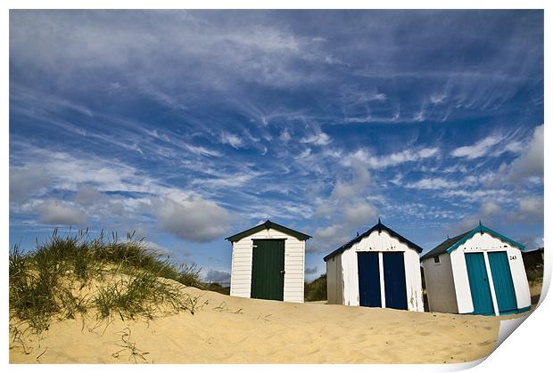 Clouds over Southwold Beach Huts Print by Paul Macro