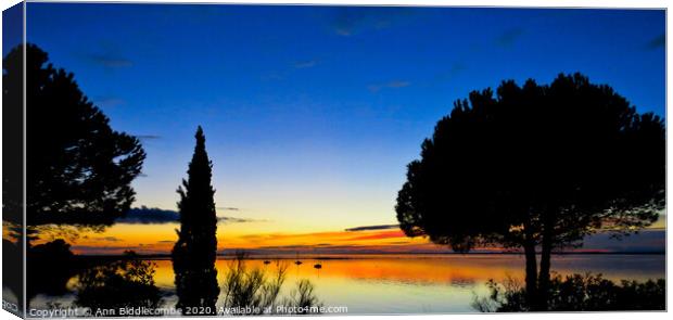Sunset over the Lake in Sete Canvas Print by Ann Biddlecombe