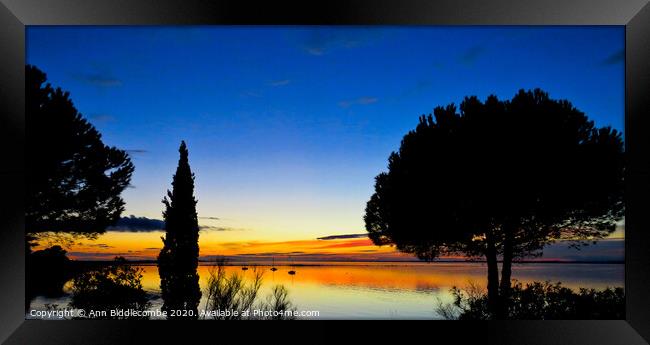 Sunset over the Lake in Sete Framed Print by Ann Biddlecombe