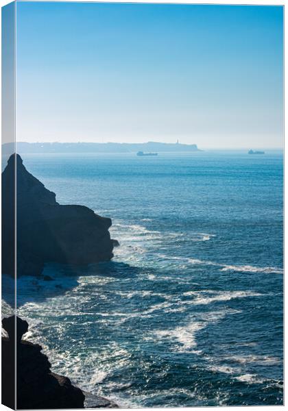 coastline cut into the ocean with boats and lighthouse Cabo Mayor Canvas Print by David Galindo