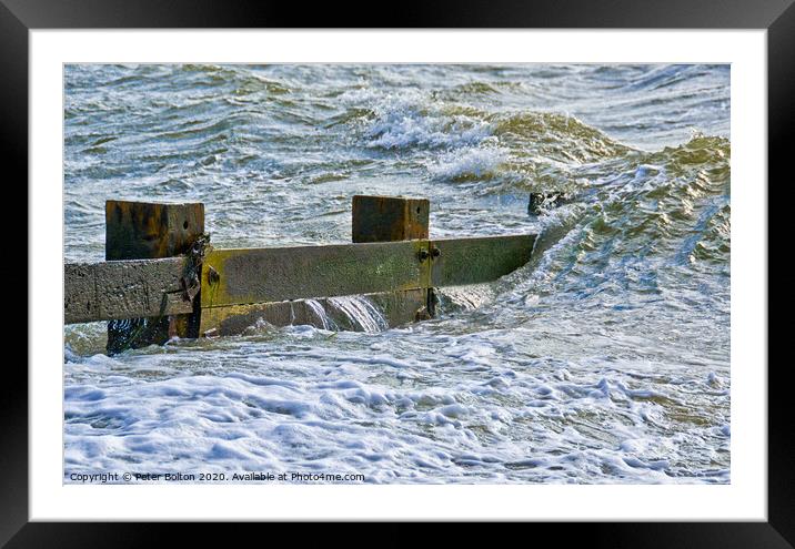Waves break over a wooden groyne at Southend on Sea, Essex, UK Framed Mounted Print by Peter Bolton