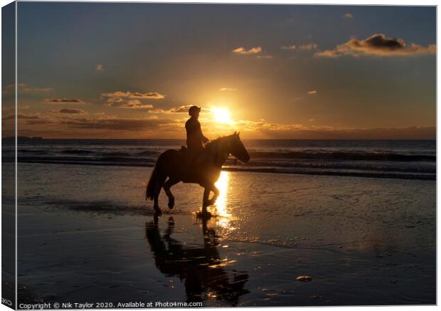 Horse riding on the beach Canvas Print by Nik Taylor