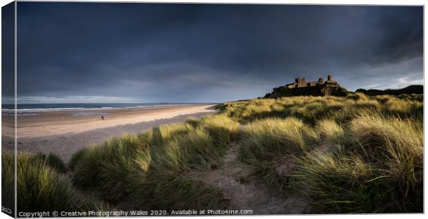 Bamburgh Castle on the Northumberland Coast Canvas Print by Creative Photography Wales