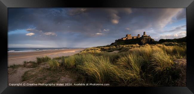 Bamburgh Castle on the Northumberland Coast Framed Print by Creative Photography Wales