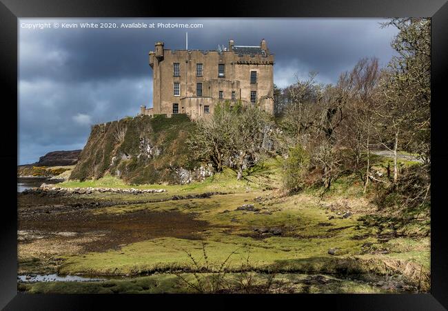 Dunvegan Castle by the sea Framed Print by Kevin White