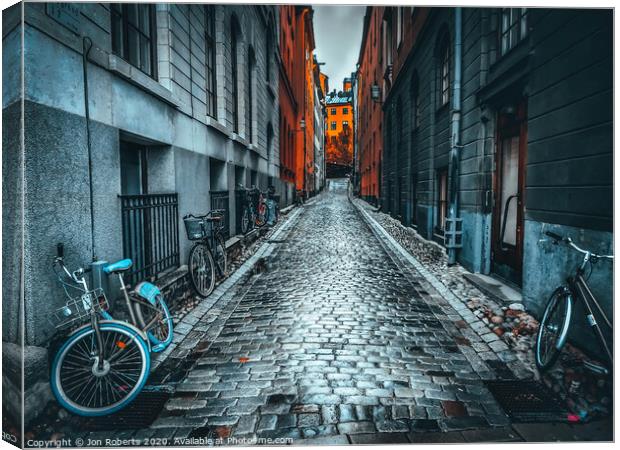 Cobbles and cycles Canvas Print by Jon Roberts