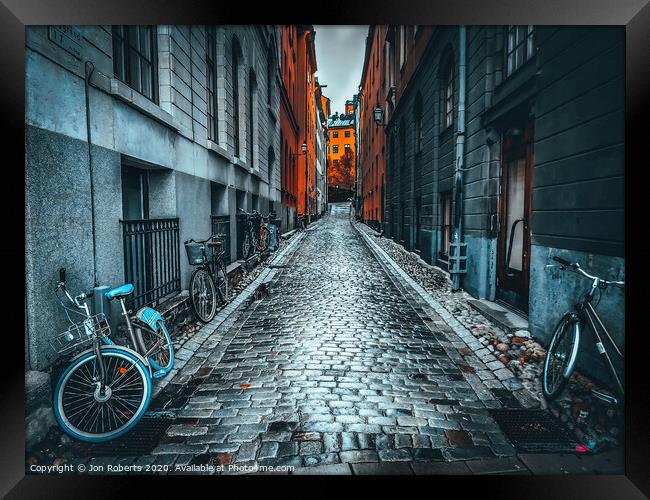 Cobbles and cycles Framed Print by Jon Roberts