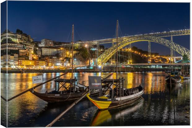 Rabelo boats of Porto in Portugal with bridge Canvas Print by Steve Heap