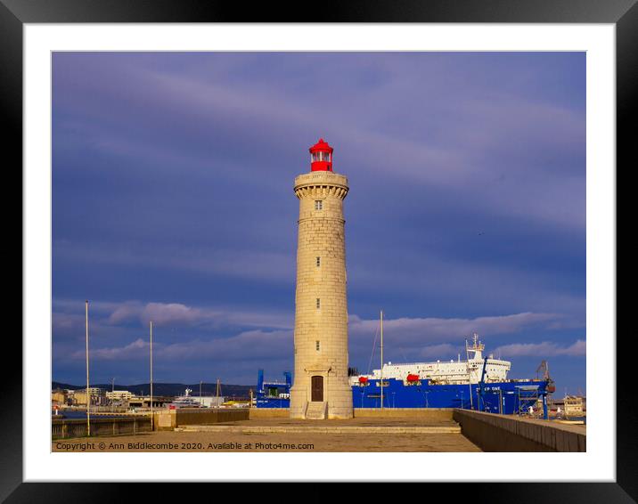 Sete Lighthouse under stormy skys Framed Mounted Print by Ann Biddlecombe