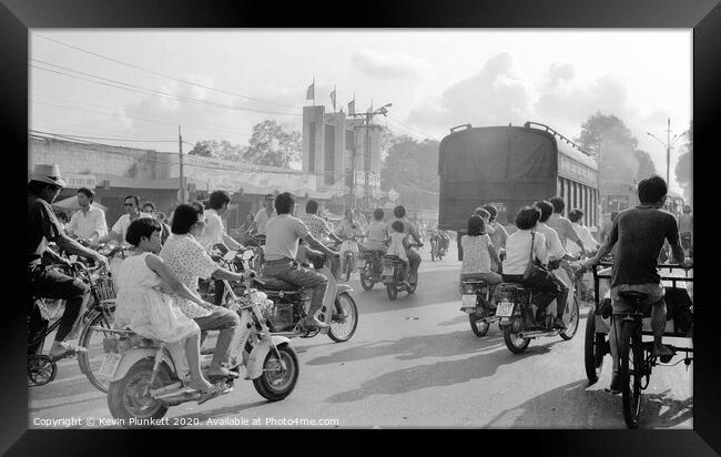 Rush hour in Ho Chi Minh City, Vietnam Framed Print by Kevin Plunkett