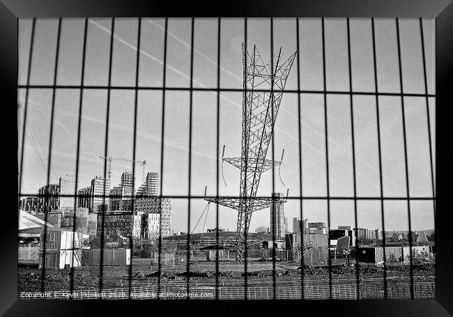 Upside down electricity pylon. Greenwich, London  Framed Print by Kevin Plunkett