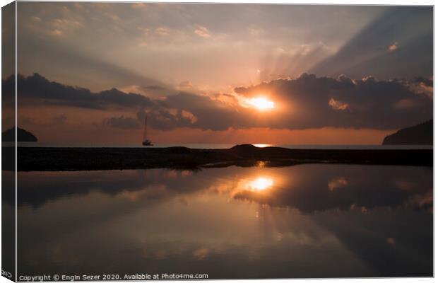 Sunrise and sunbeams at The Beach Of Adrasan at An Canvas Print by Engin Sezer