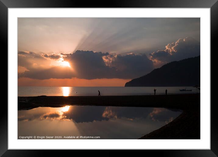 Wonderful sunrise, sunbeams and tourists at The Be Framed Mounted Print by Engin Sezer