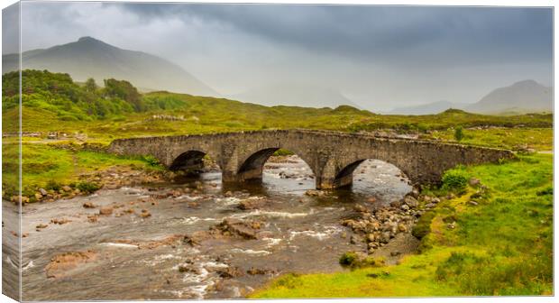 Sligachan bridge by the River Sligachan, on a overcast summers morning on the Isle of Skye, Scotland, with the Cuillin Mountains in the background. Canvas Print by SnapT Photography