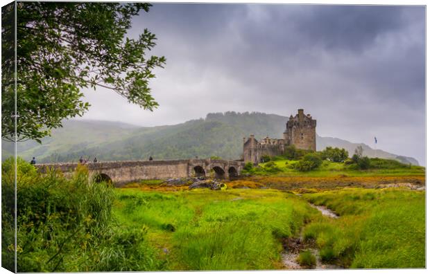 Looking out to Eilean Donan Castle, where three sea lochs meet, Loch Duich, Loch Long and Loch Alsh, on an overcast day in the Sco Canvas Print by SnapT Photography