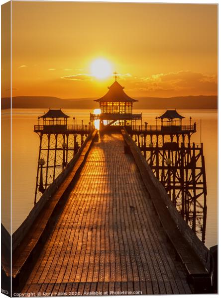 Clevedon Pier with a golden reflection Canvas Print by Rory Hailes