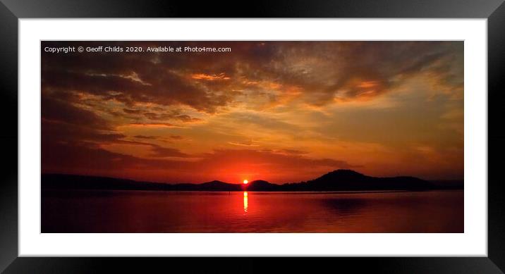  Crimson sunrise with water reflections.   Framed Mounted Print by Geoff Childs