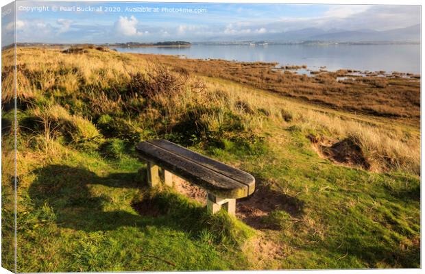 Bench on the Shores of the Menai Strait Anglesey Canvas Print by Pearl Bucknall