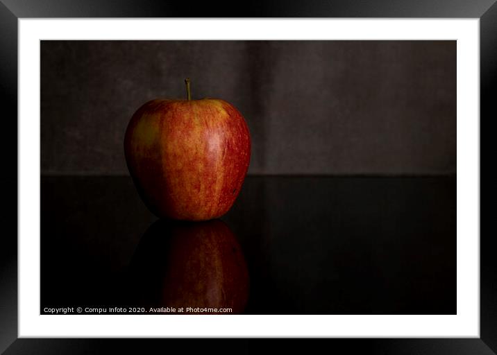 One red apple isolated on black Framed Mounted Print by Chris Willemsen