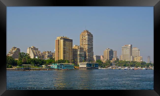 A part of the city skyline from the River Nile, Cairo, Egypt. Framed Print by Peter Bolton