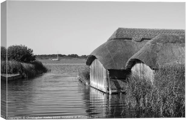 Hickling boathouses  Canvas Print by Christopher Keeley