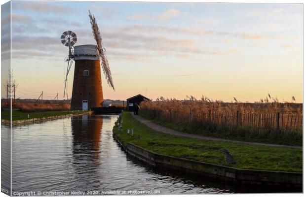 Sunset over Horsey Windpump Canvas Print by Christopher Keeley