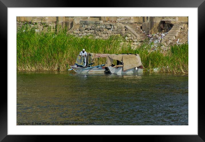 Local fishermen moored on the Nile riverbank near Cairo, Egypt. Framed Mounted Print by Peter Bolton