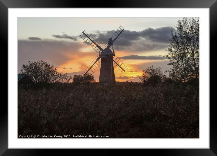 Norfolk windmill sunset Framed Mounted Print by Christopher Keeley