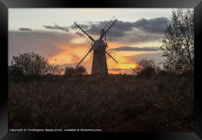 Norfolk windmill sunset Framed Print by Christopher Keeley