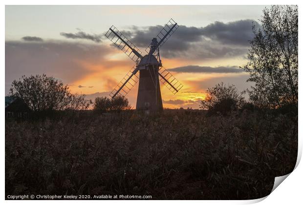 Norfolk windmill sunset Print by Christopher Keeley