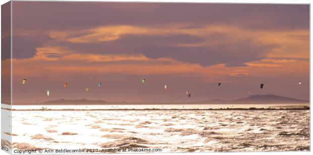 Kite Surfers over the Lake in Sete Canvas Print by Ann Biddlecombe