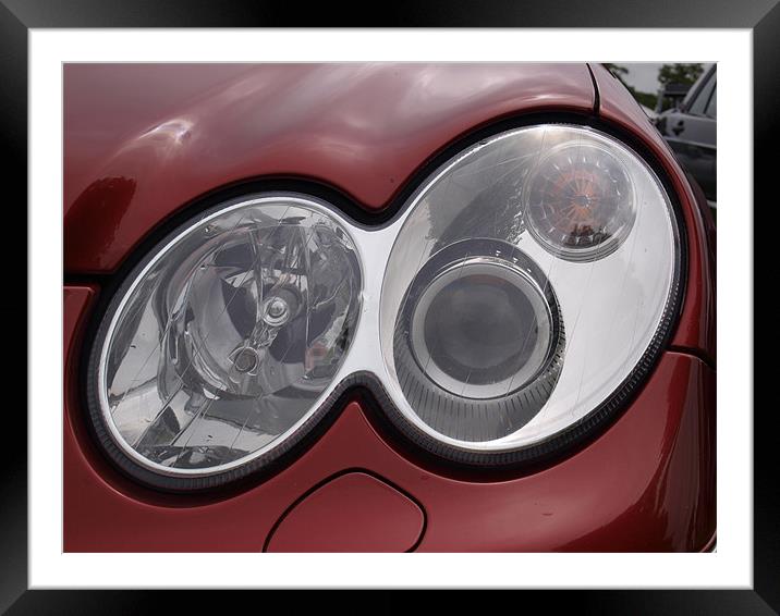 Maroon Mercedes headlight Framed Mounted Print by Allan Briggs