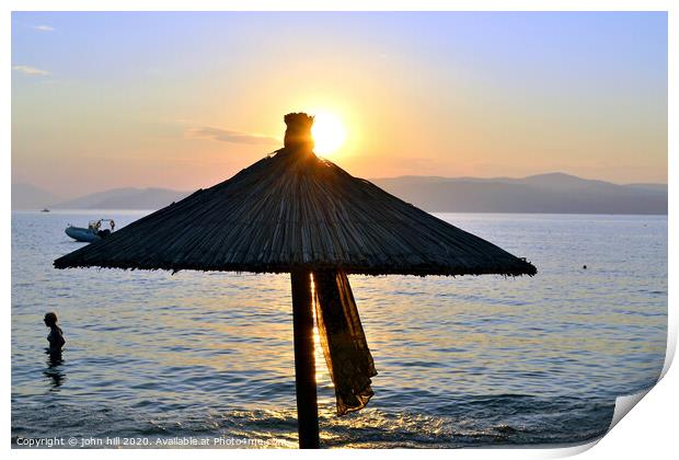 Sunset at Ag Eleni beach on Skiathos in Greece. Print by john hill