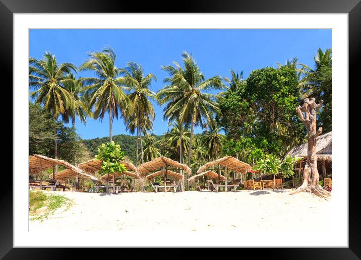 Straw huts on Bamboo Beach Framed Mounted Print by Kevin Hellon