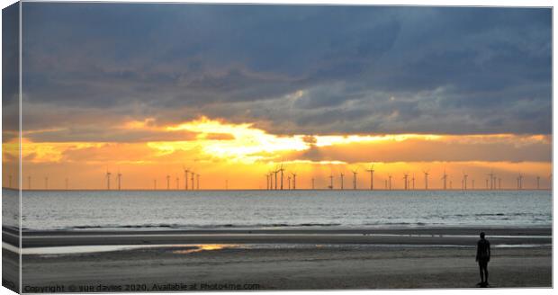 crosby windfarm and statues at sunset Canvas Print by sue davies