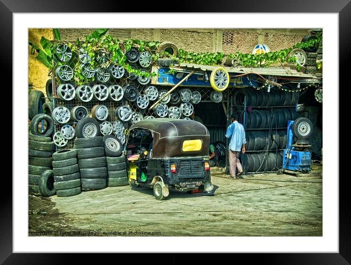 Tyre fitter business on the outskirts of Cairo, Egypt. Framed Mounted Print by Peter Bolton