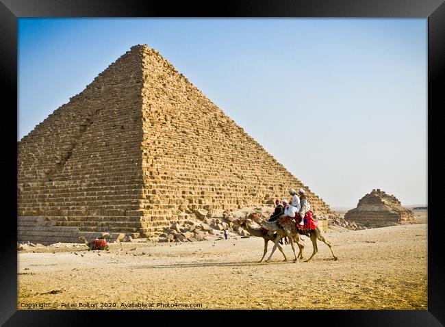 Pyramid of Menkaure with passing camels, Giza, Egypt. Framed Print by Peter Bolton