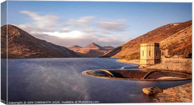 Tranquil Waters Reflect the Majestic Mourne Mounta Canvas Print by KEN CARNWATH