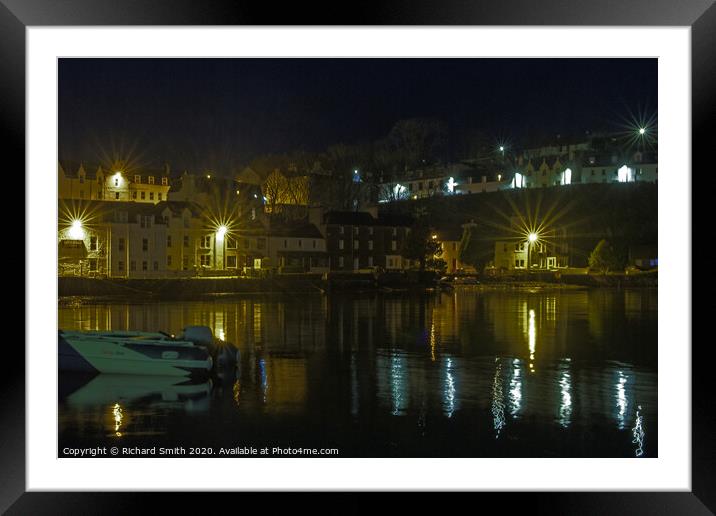 Illuminated buildings at the beach end of Portree Harbour Framed Mounted Print by Richard Smith